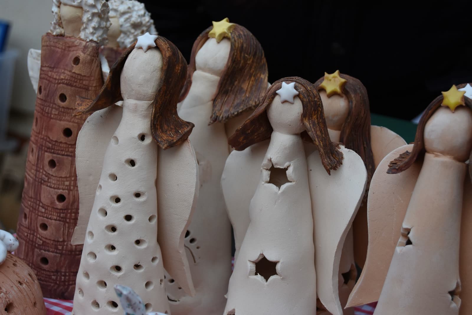 Handmade ceramic angels with golden stars